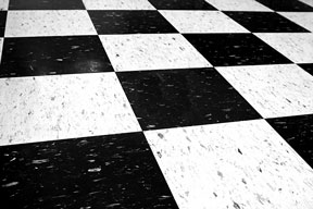 black and white vinyl tile arranged in a checkerboard pattern